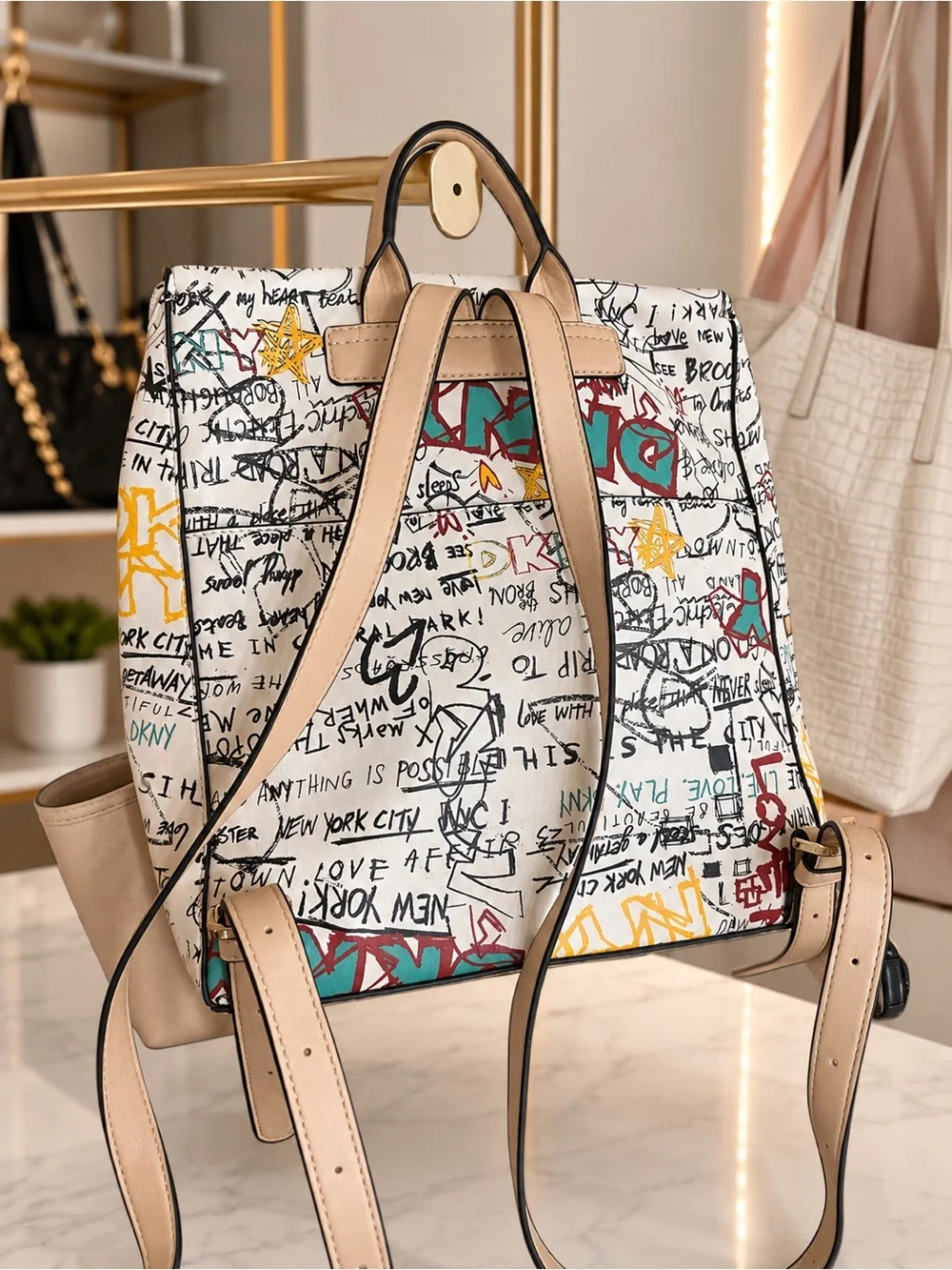 DKNY Cream Canvas Graffiti Print Backpack with Tan Straps